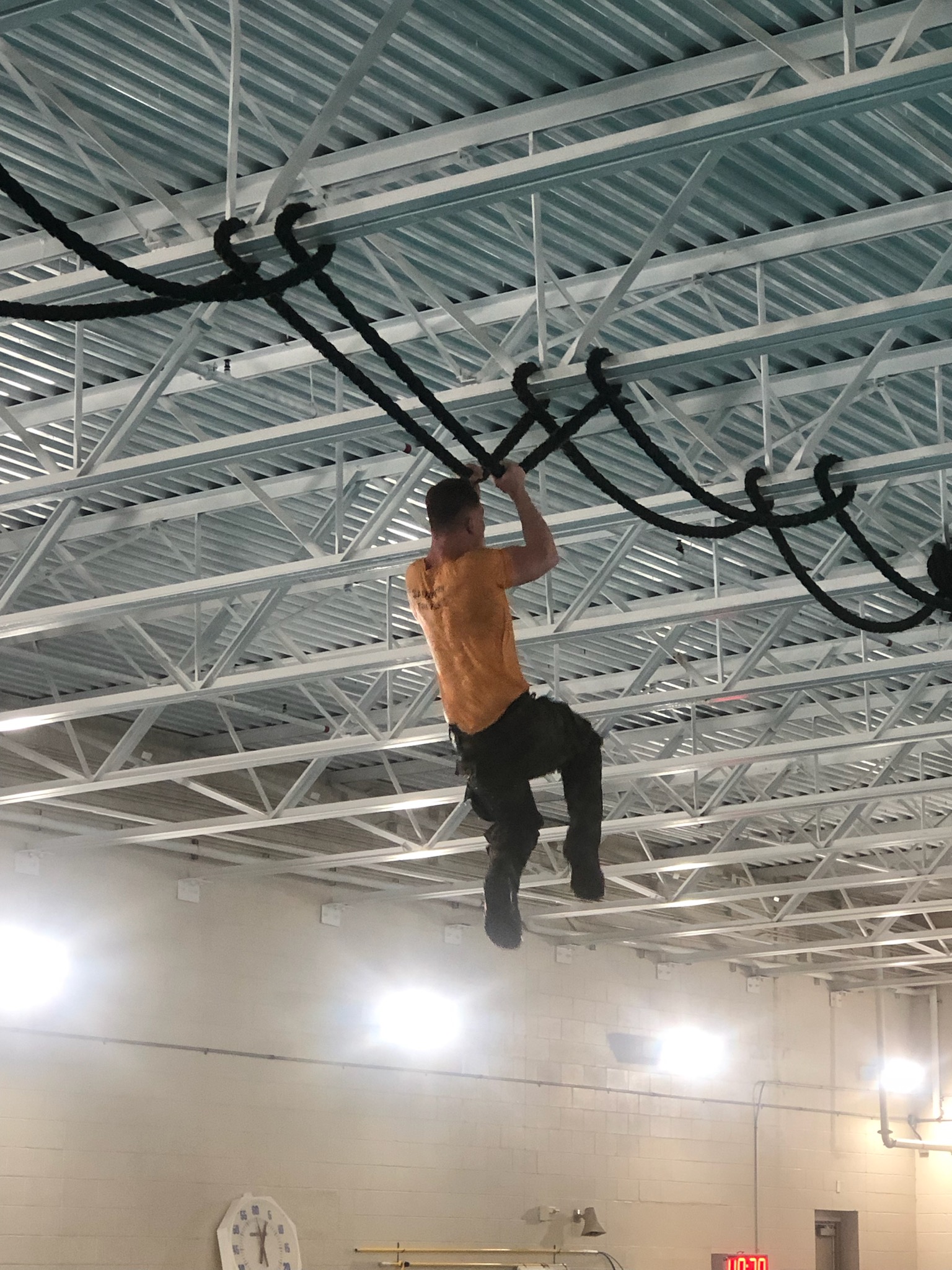Bobby Saunders climbing a rope during Air Force Special Warfare training
